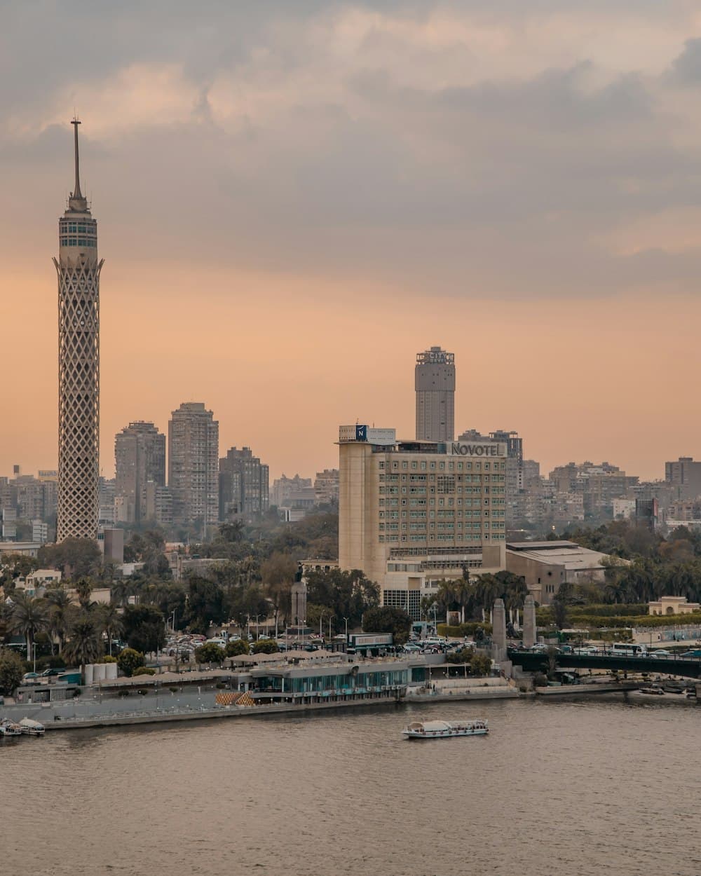 Cairo Tower and the city skyline above the Nile at dusk